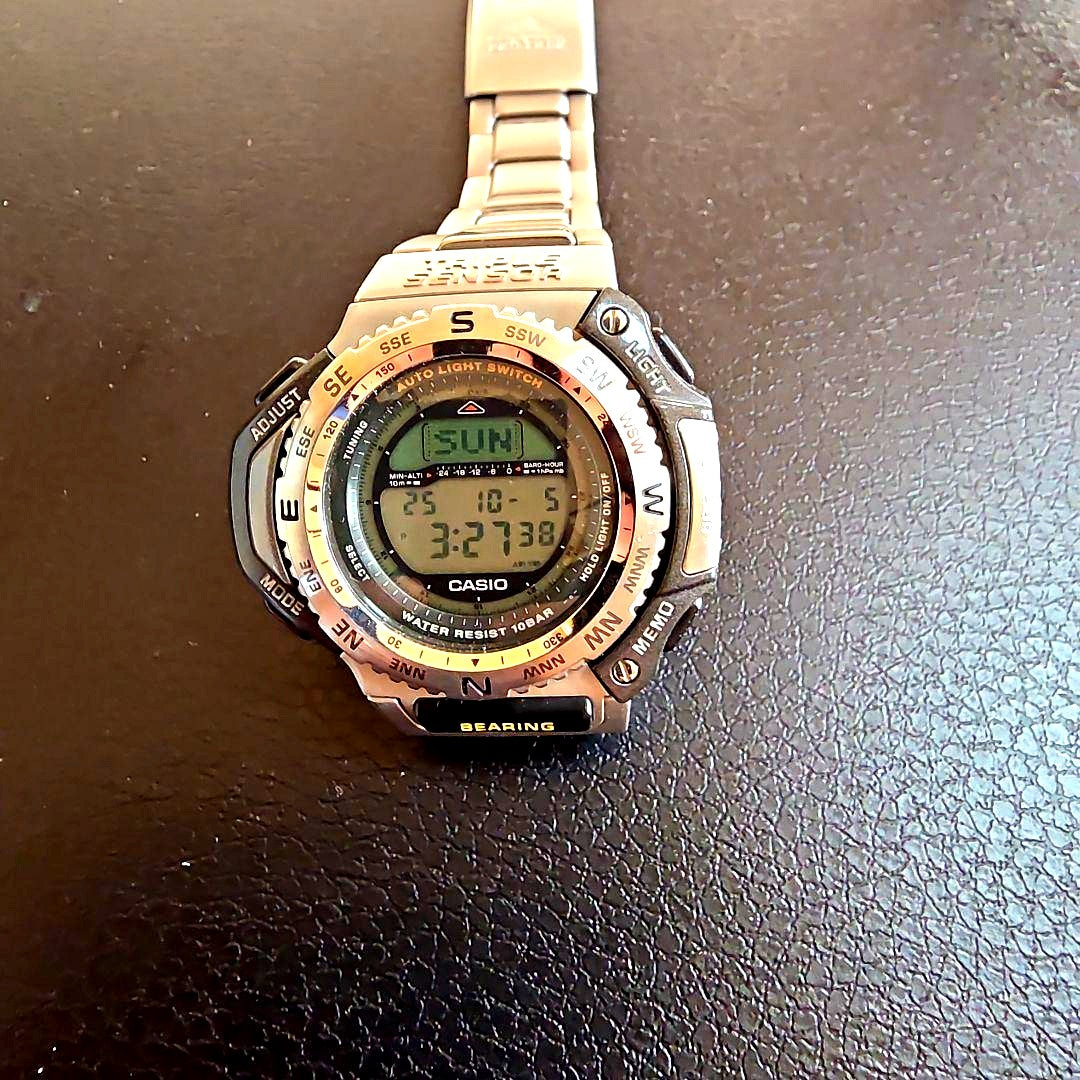 Used Casio Pro Trek men's wristwatch with visible scratches and dirt on band and case