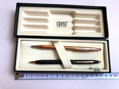 Cross gold metal ballpoint pen paired with black metal mechanical pencil set