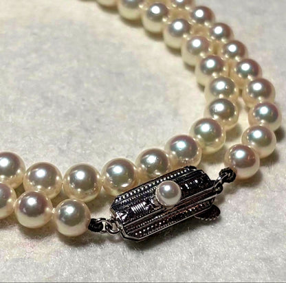 Mikimoto Akoya pearl necklace with 5.5 to 5.9mm pearls, 38cm length, silver clasp, displayed with genuine case