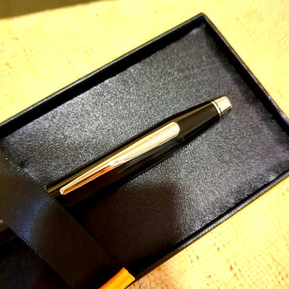 CROSS black metal ballpoint pen with slim design displayed next to a black gift box