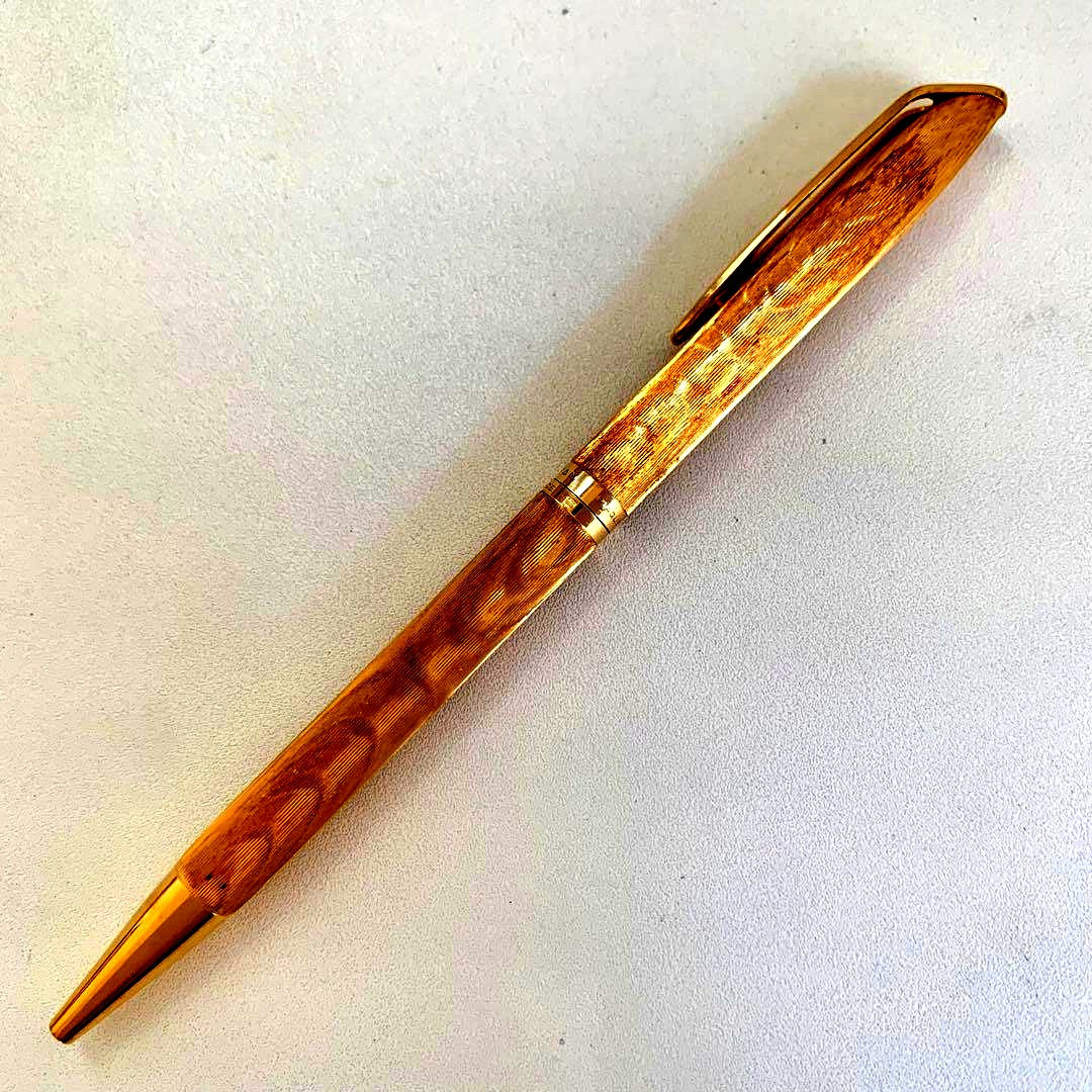 Sheaffer vintage gold plated twist ballpoint pen with tarnished surface and reversible rotation mechanism