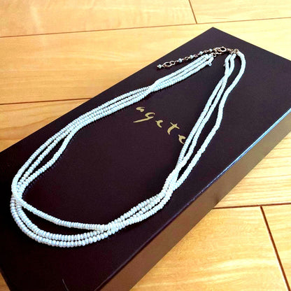Baby Pearl Three-Strand Necklace with three white pearls on a 40 cm chain