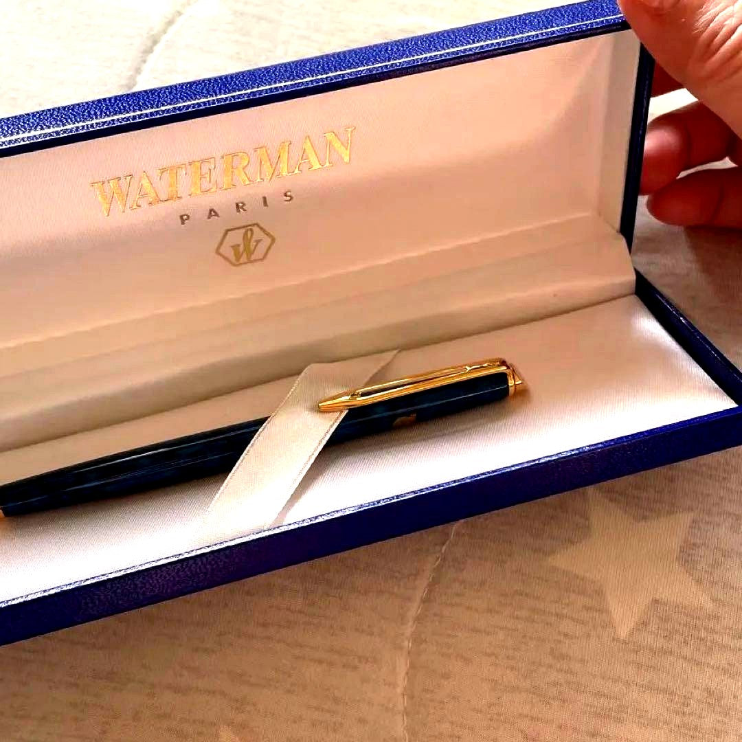 WATERMAN blue ballpoint pen displayed with its dedicated case on a white background