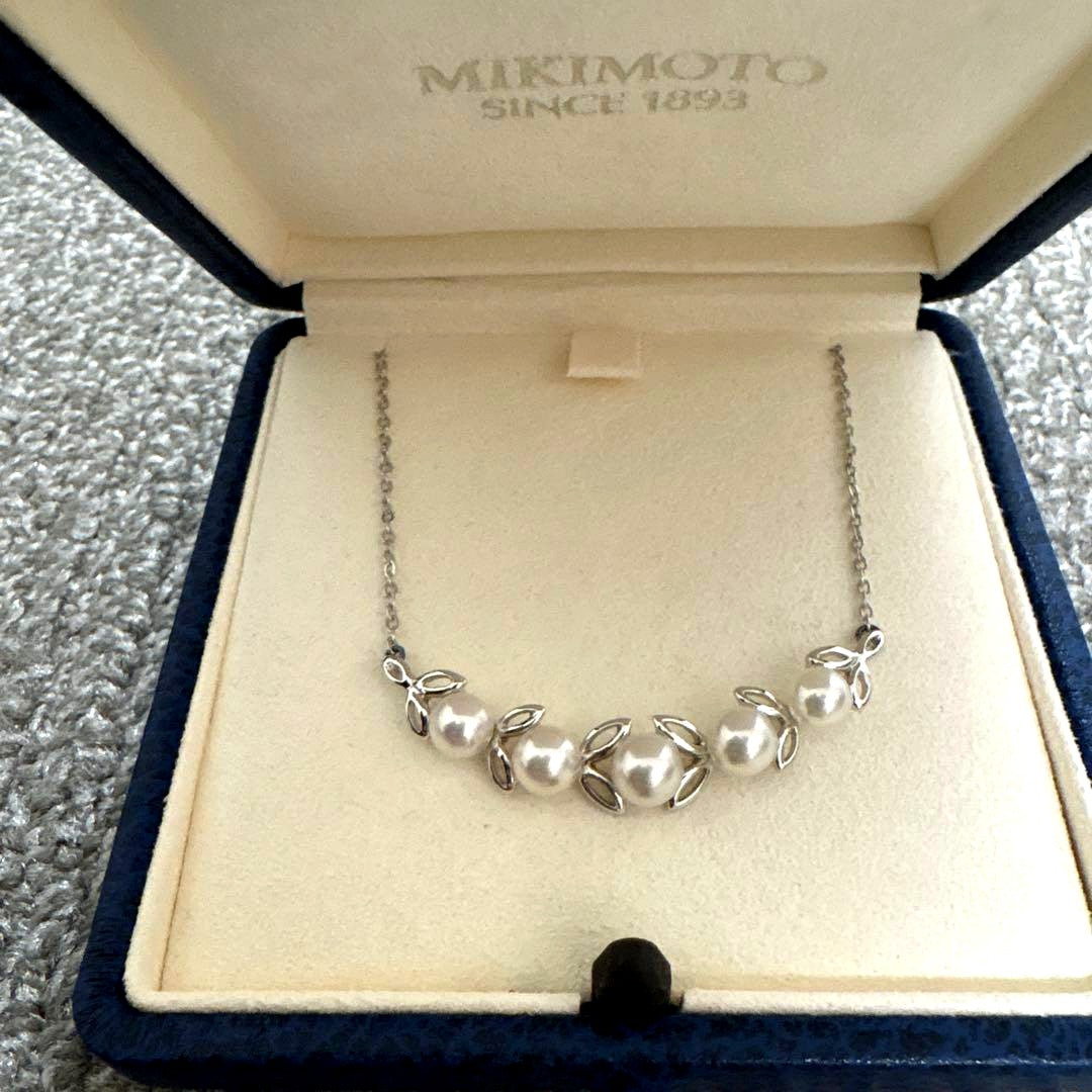 MIKIMOTO Pearl Leaf Motif Necklace featuring pearls and leaf design with chain, displayed with dedicated case