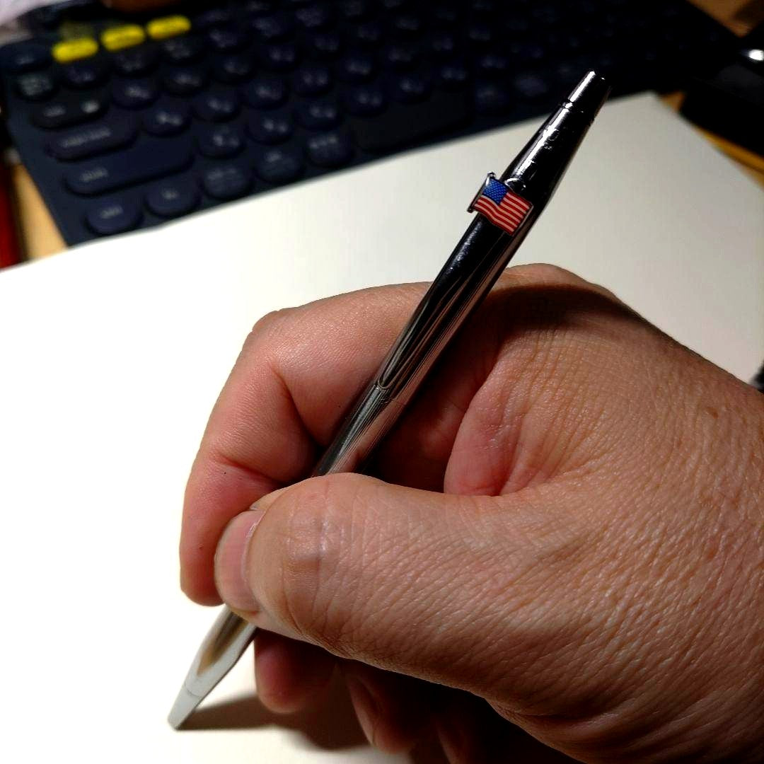 Silver CROSS USA Classic Century Ballpoint Pen with slim metal body and U.S. flag on the clip