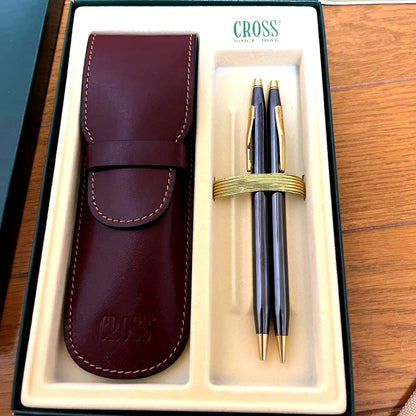 Cross ballpoint pen and mechanical pencil set with matching pen case on white background