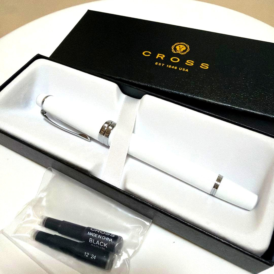 Cross white fountain pen with silver accents and two black ink cartridges in white outer box