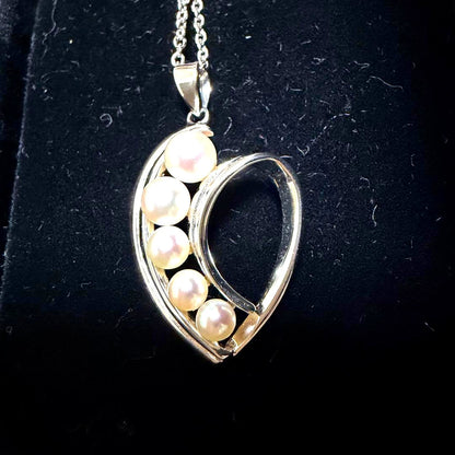 Mikimoto heart-shaped pearl pendant necklace featuring five pearls with silver decoration and included box