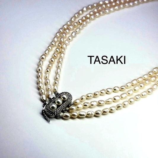 Tasaki SV Baroque Pearl triple strand necklace approximately 55cm long displayed on white background