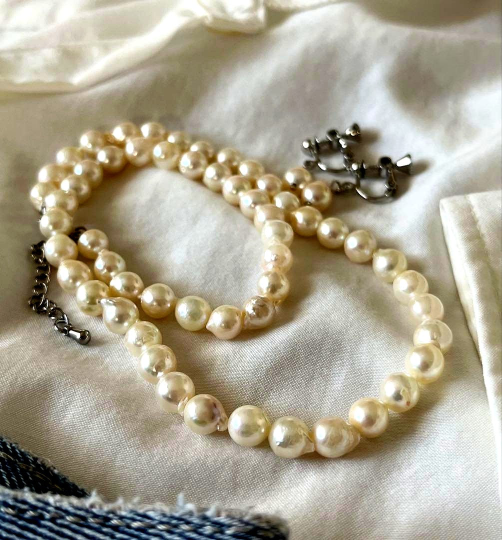 Akoya pearl necklace and earring set with 6.5 to 7 mm pearls, stainless steel clasp, and rhodium plated screw-back earrings