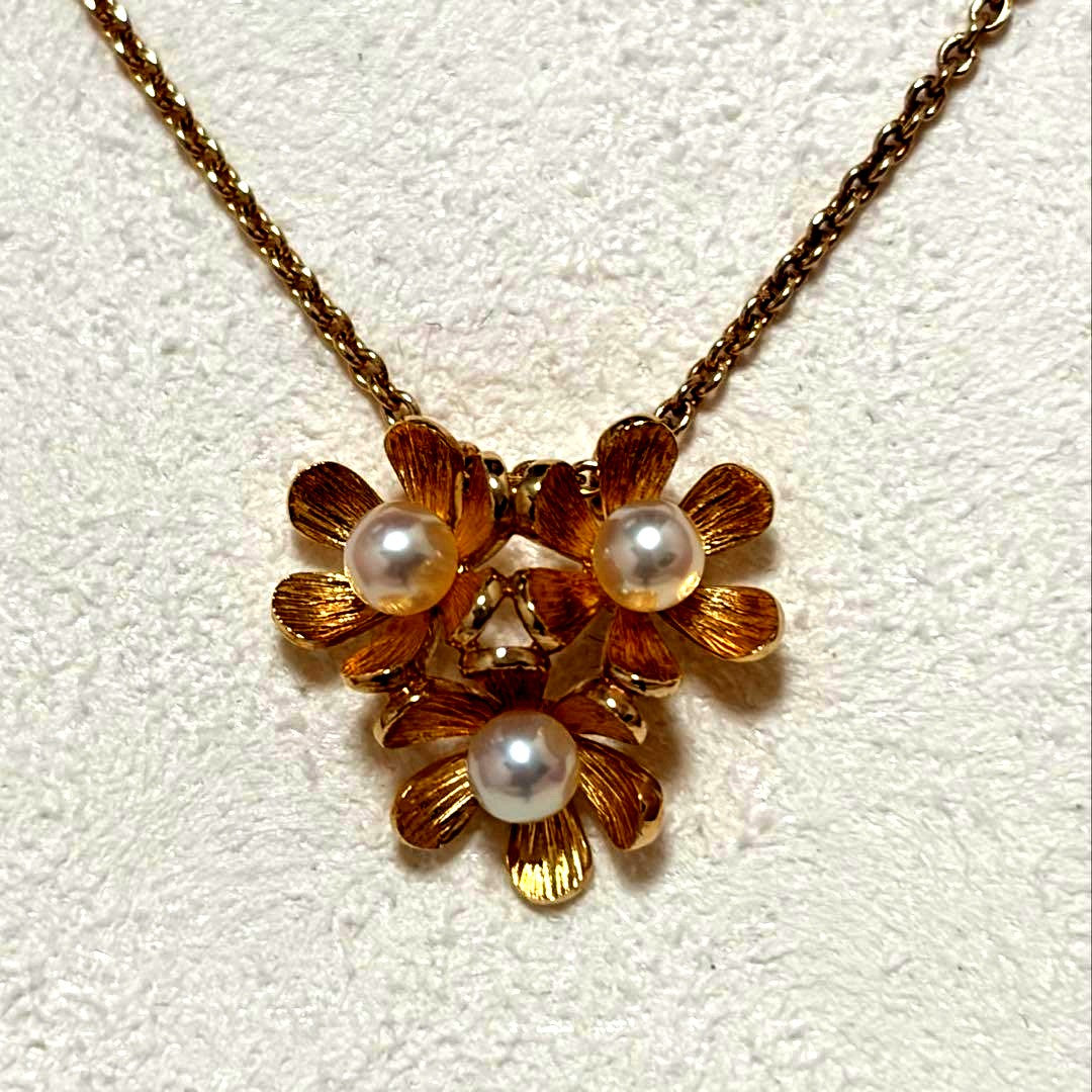 Mikimoto K18 gold baby pearl necklace with 3-row flower motif design weighing 4.5 grams