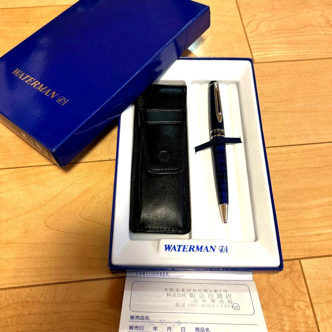 WATERMAN ballpoint pen with blue ink alongside its protective case on a white background