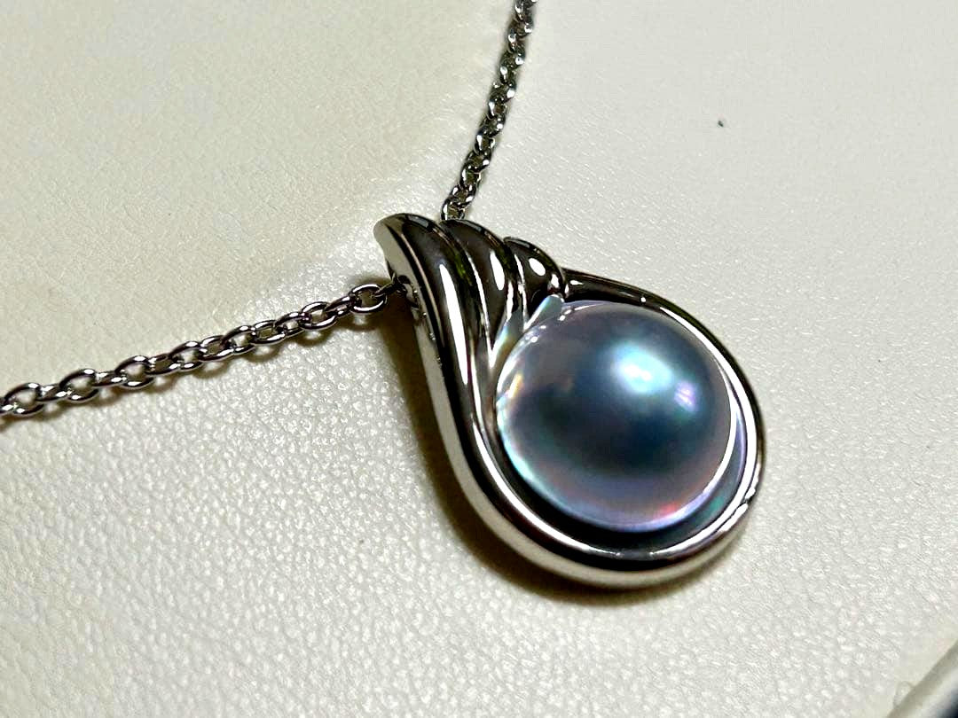 Tasaki pearl necklace with a 12mm Mabe pearl pendant on a silver chain showing Tasaki silver stamp