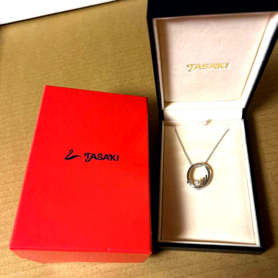 TASAKI silver necklace with oval pearl pendant displayed on white background with dedicated box