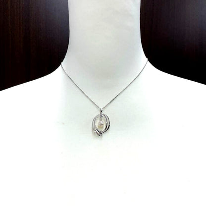 Mikimoto pearl necklace in silver with detailed clasp and round pearls displayed