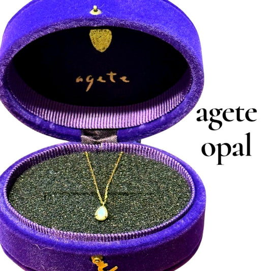 agete K10 gold necklace featuring a glowing opal pendant on a delicate chain