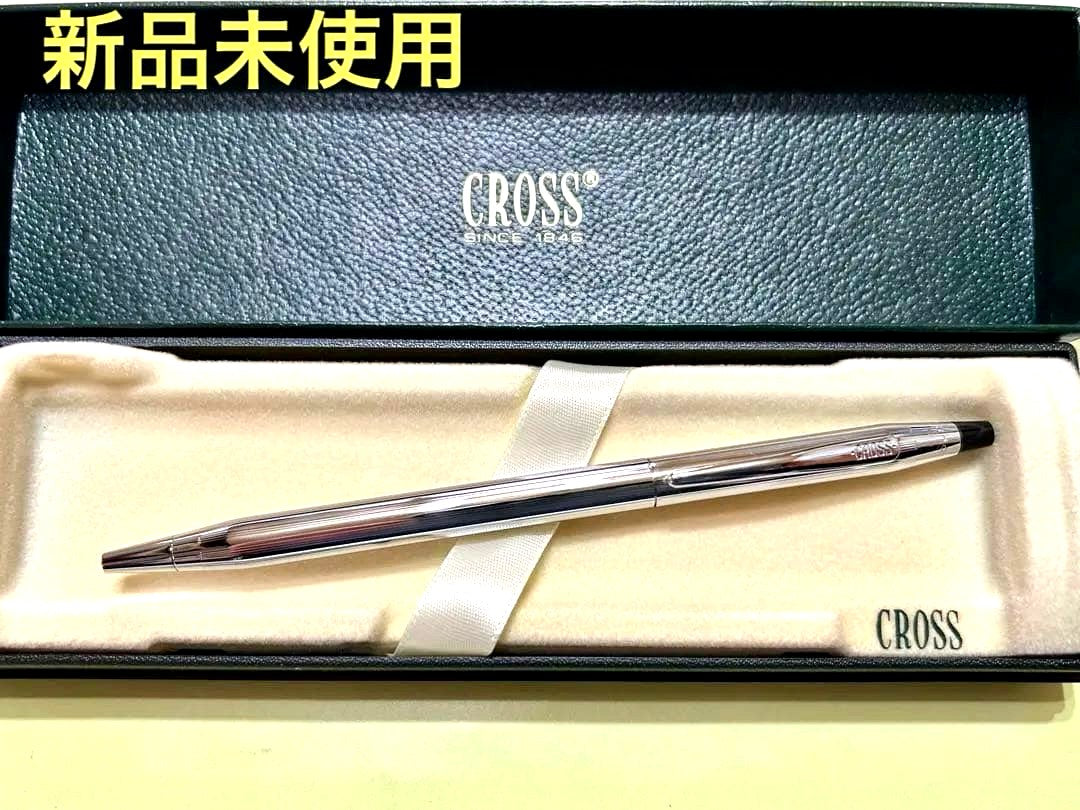 New unused CROSS ballpoint pen in original box with sleek black barrel and silver clip