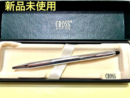 New unused CROSS ballpoint pen in original box with sleek black barrel and silver clip