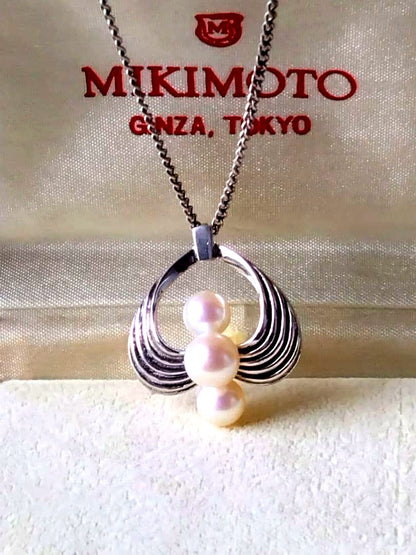 Vintage MIKIMOTO Akoya pearl necklace featuring three 6.5-7.5 mm pearls on a 40 cm silver chain