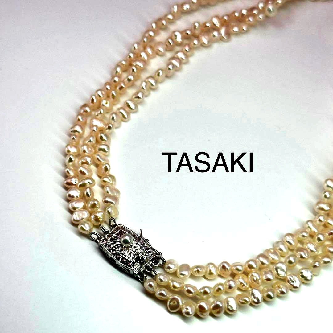 Tasaki Baroque Pearl three-strand necklace about 80cm long displayed on a white background