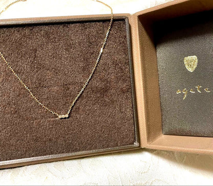 agete K10 Tres Necklace featuring three diamonds on adjustable 40 cm gold chain