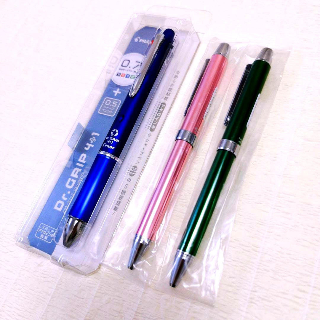 Set of three Pilot multi-function pens including two EVOLT 2+1 pens and one Dr.Grip 4+1 navy pen