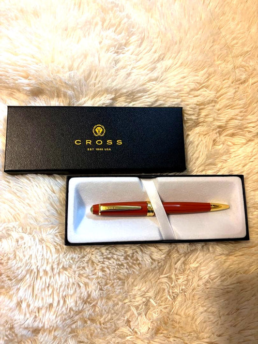 CROSS Ballpoint Pen in bright orange color, sleek design, unused condition