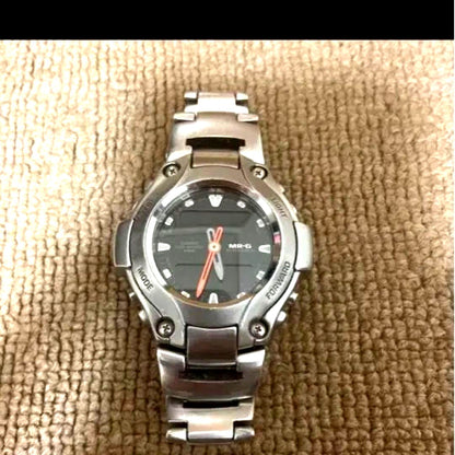 Casio G-Shock MR-G series stainless steel watch with silver case and bracelet