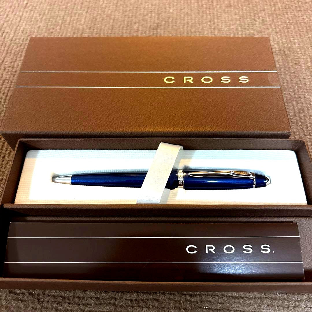 Cross Blue metal ballpoint pen with twist design and dedicated case on white background