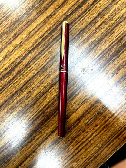 PILOT burgundy fountain pen with 14K gold fine nib displayed on white background