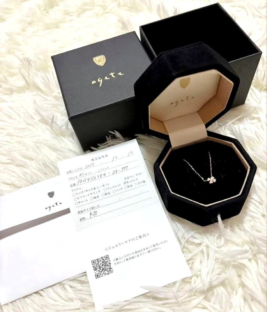 agete K10 gold tone diamond necklace with 0.05ct clover pendant displayed on white background