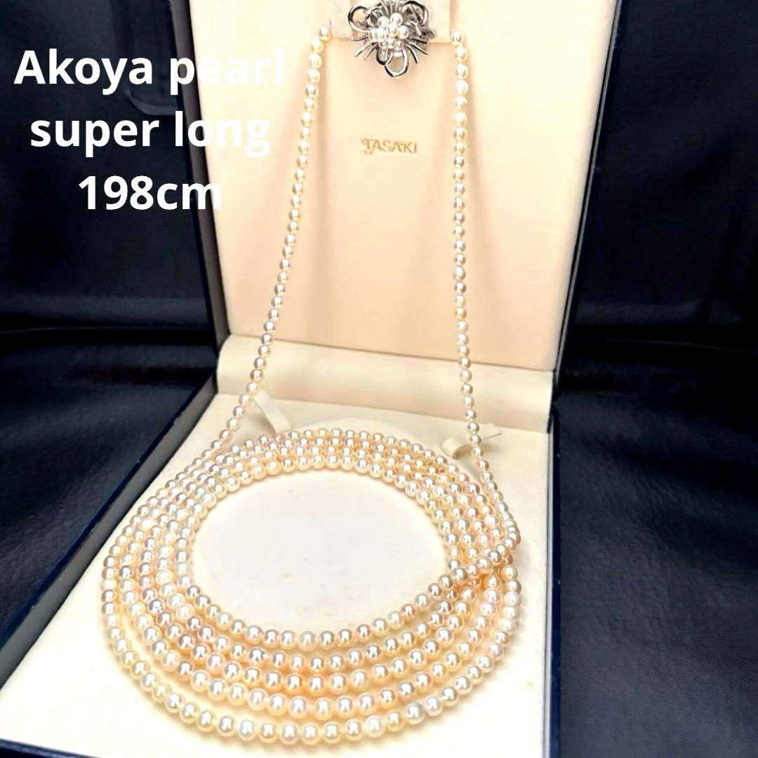 Long Akoya pearl necklace with 4-6mm white pearls measuring 198cm featuring multiple strands and silver marks