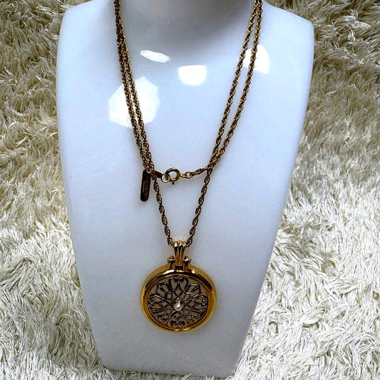 Mikimoto single pearl necklace with loupe showing pristine used condition and elegant design