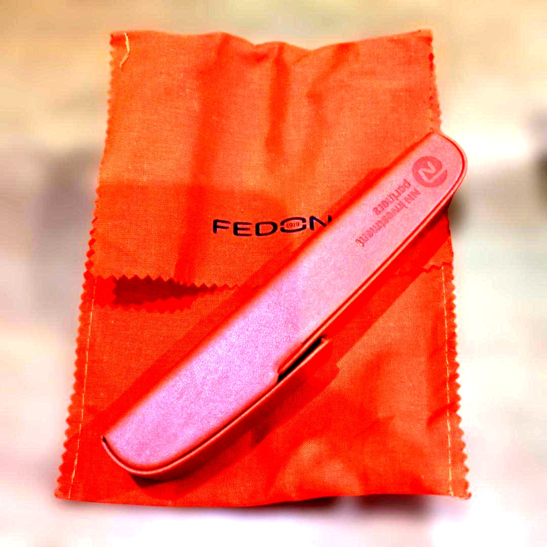 Giorgio Fedon Charme slim orange pen case with magnetic closure and included cleaning cloth bag
