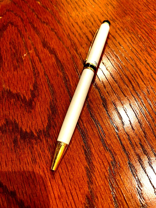Pilot ballpoint pen with white metal body, gold trim, and blue top shown on a white background