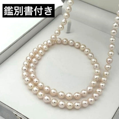 Akoya pearl necklace with 8.0mm-8.5mm pearls, 80cm length, white lustrous pearls on a display