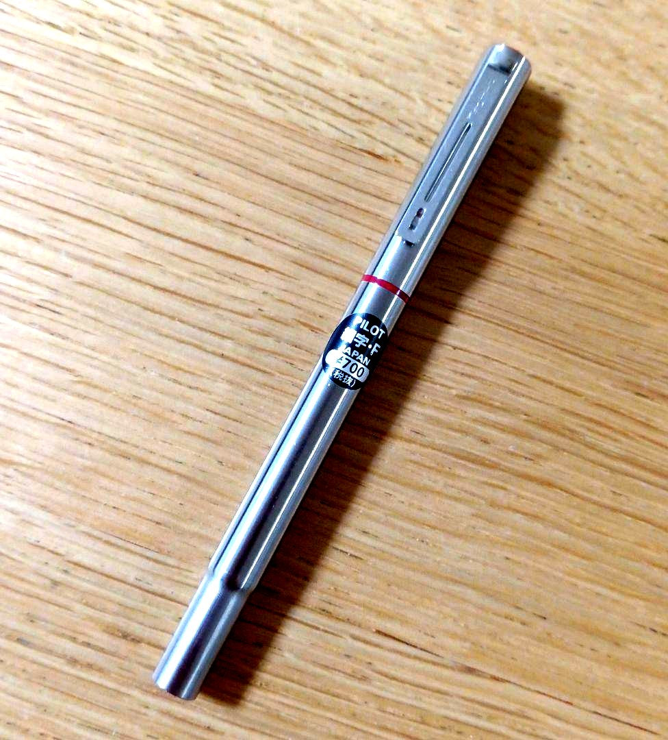 Pilot Birdie Mini Fountain Pen with silver and red body and fine nib displayed on white background