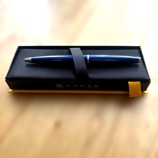 Cross ballpoint pen with blue body, silver accents, and included gift case