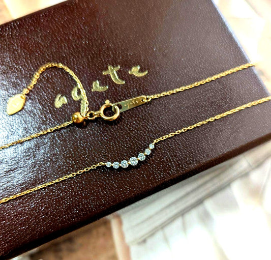 Agate K18 necklace featuring 0.1ct diamond with adjustable slide chain on white background