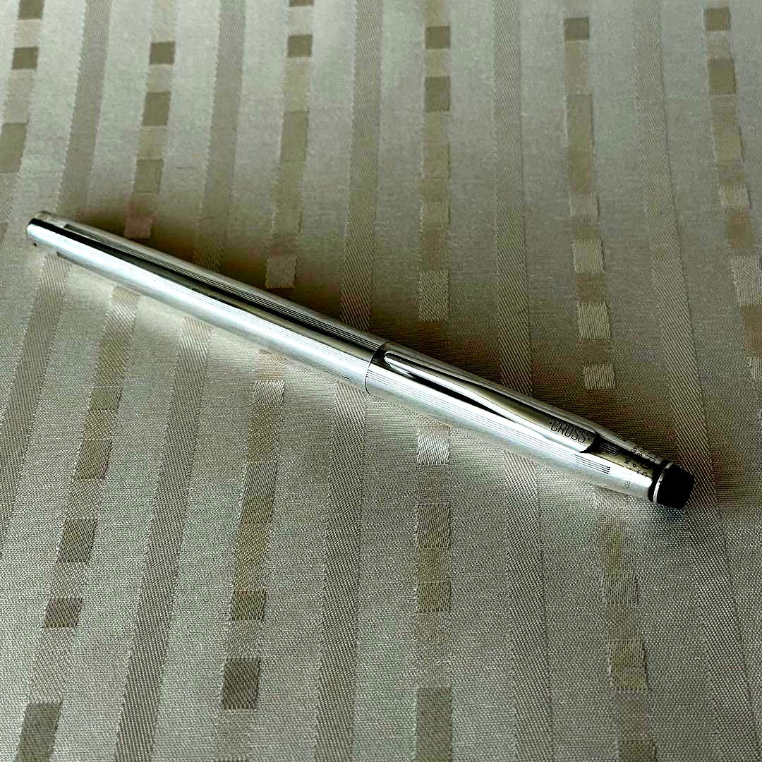 Cross silver plated cap-type rollerball pen made in USA with sleek design and silver body