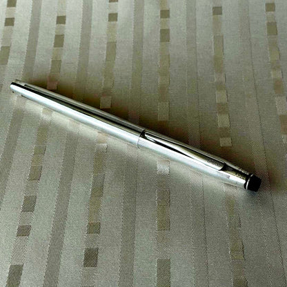 Cross silver plated cap-type rollerball pen made in USA with sleek design and silver body
