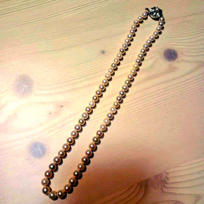 Akoya pearl necklace featuring white pink 6mm pearls strung on a 42cm chain