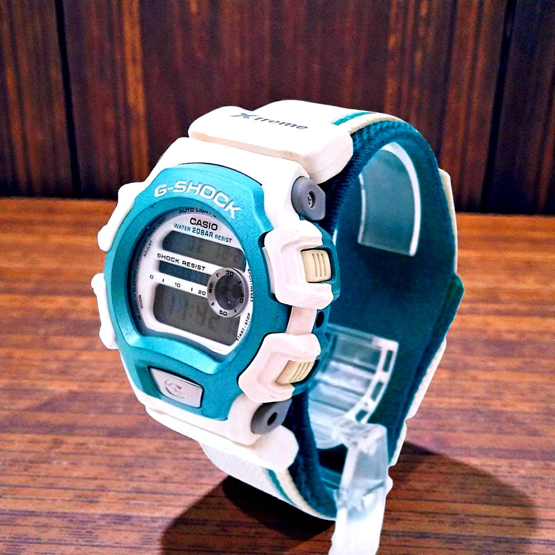 G-Shock DW-004 digital watch in blue and white with shock resistance and 20-meter water resistance