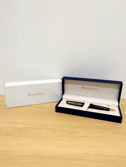 Waterman PARIS black and gold ballpoint pen with plastic and metal body shown with case