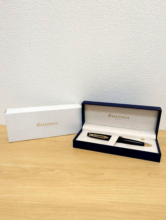 Waterman PARIS black and gold ballpoint pen with plastic and metal body shown with case