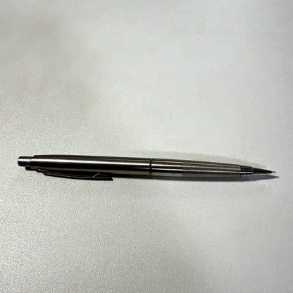 Vintage PILOT silver mechanical pencil with slim metal body and clip on a white background