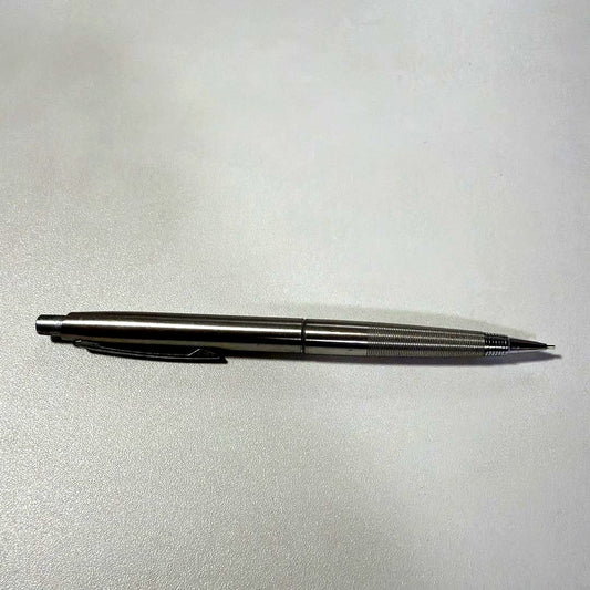 Vintage PILOT silver mechanical pencil with slim metal body and clip on a white background
