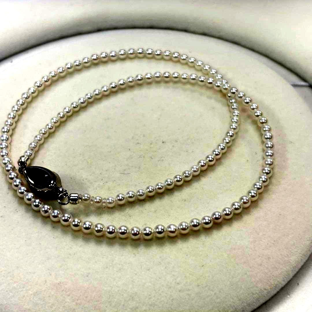 Akoya pearl necklace with uncoated 3-3.5mm baby pearls and 42cm length featuring a 925 marked clasp