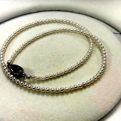 Akoya pearl necklace with uncoated 3-3.5mm baby pearls and 42cm length featuring a 925 marked clasp