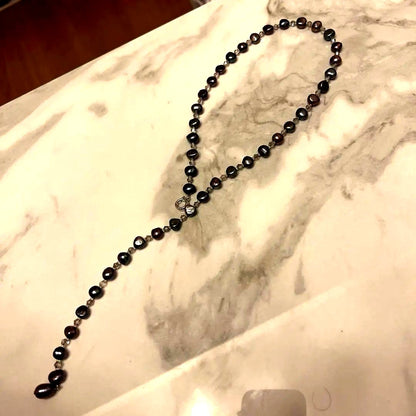 Multi-color freshwater pearl lariat necklace measuring 62 cm displayed against white background